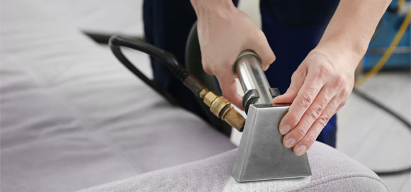 This image shows a vacuum to clean a sofa.