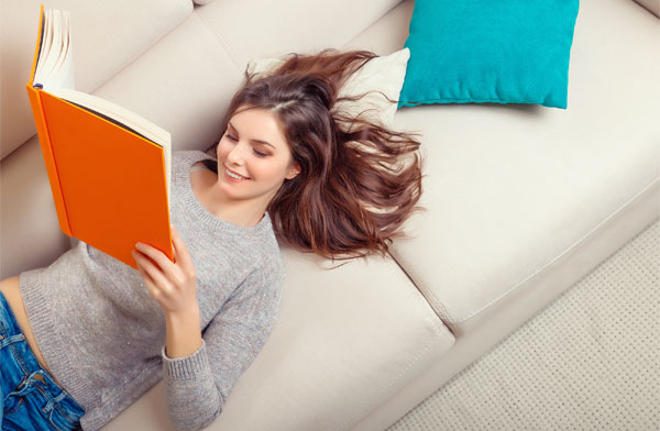This image shows a woman reading a book.