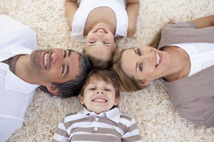 This image shows a family smiling.